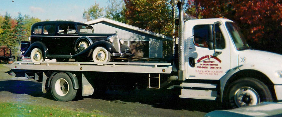 Antique car being towed